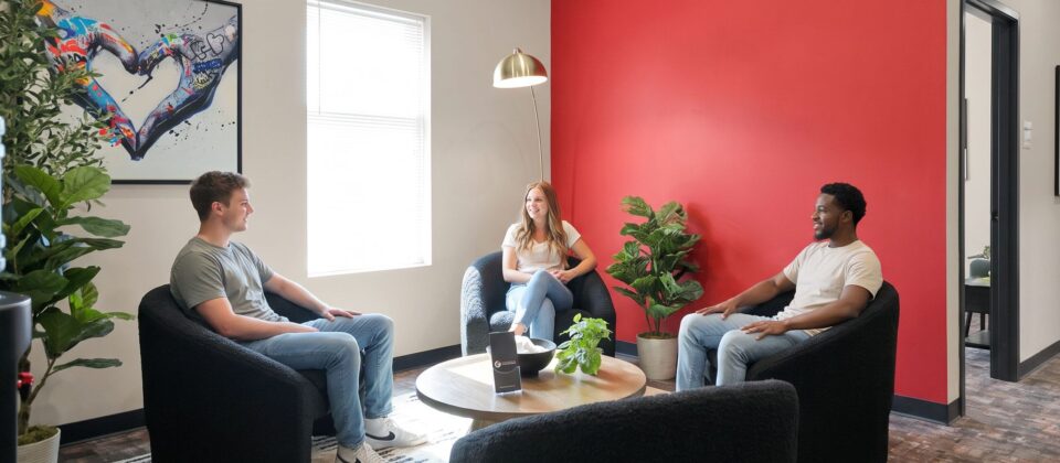 Small group session in lounge area at heroin addiction treatment facility