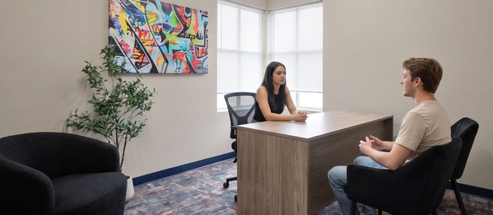 Client meeting with counselor at opioid rehab center for intake consultation