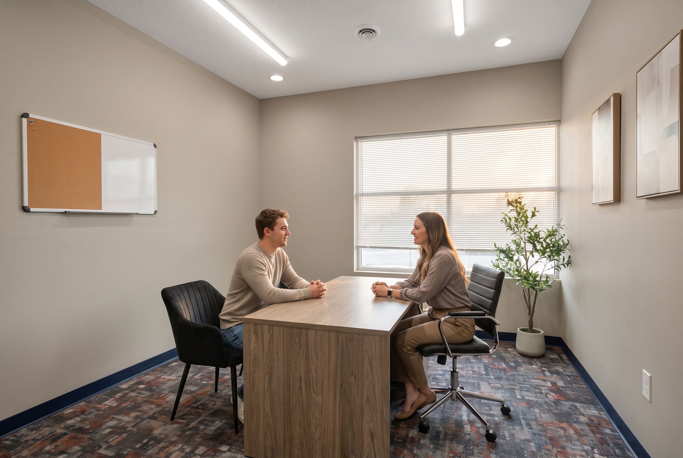 Client and counselor in office consultation at addiction treatment center in Indianapolis