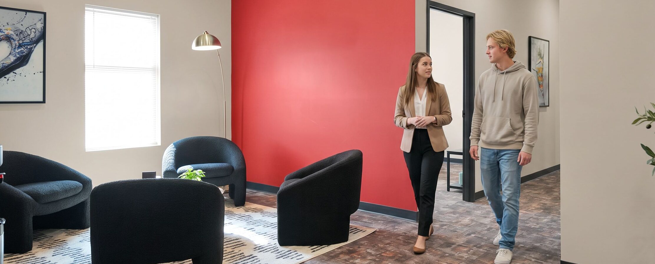 A staff member greets a client in the welcoming lounge area at our dual diagnosis treatment center in Indiana, where comprehensive care begins with a warm, personal connection