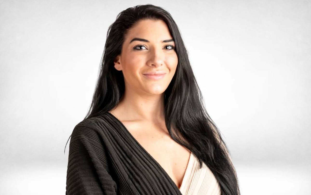 Confident young woman smiling, promoting hope and recovery services.