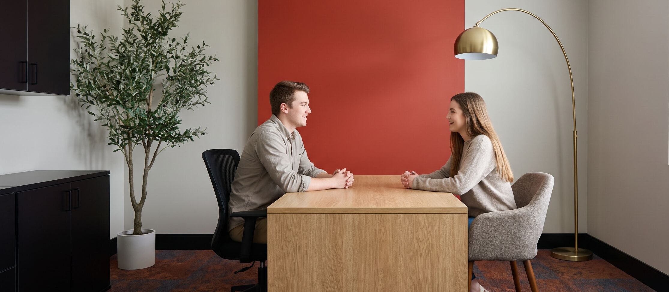 Client and counselor discussing Oxycodone addiction during office consultation
