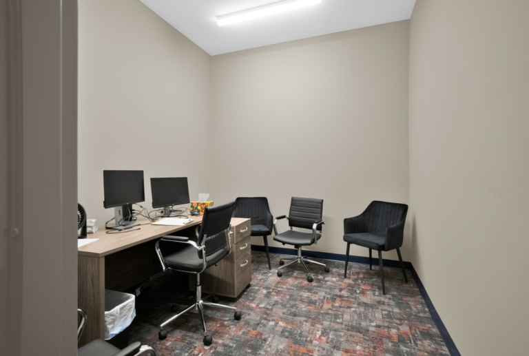 Counseling office with desks and chairs at Red Ribbon Recovery Indiana facility.