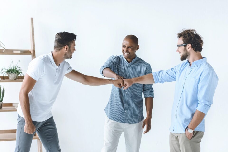 Men supporting each other in mental health awareness.
