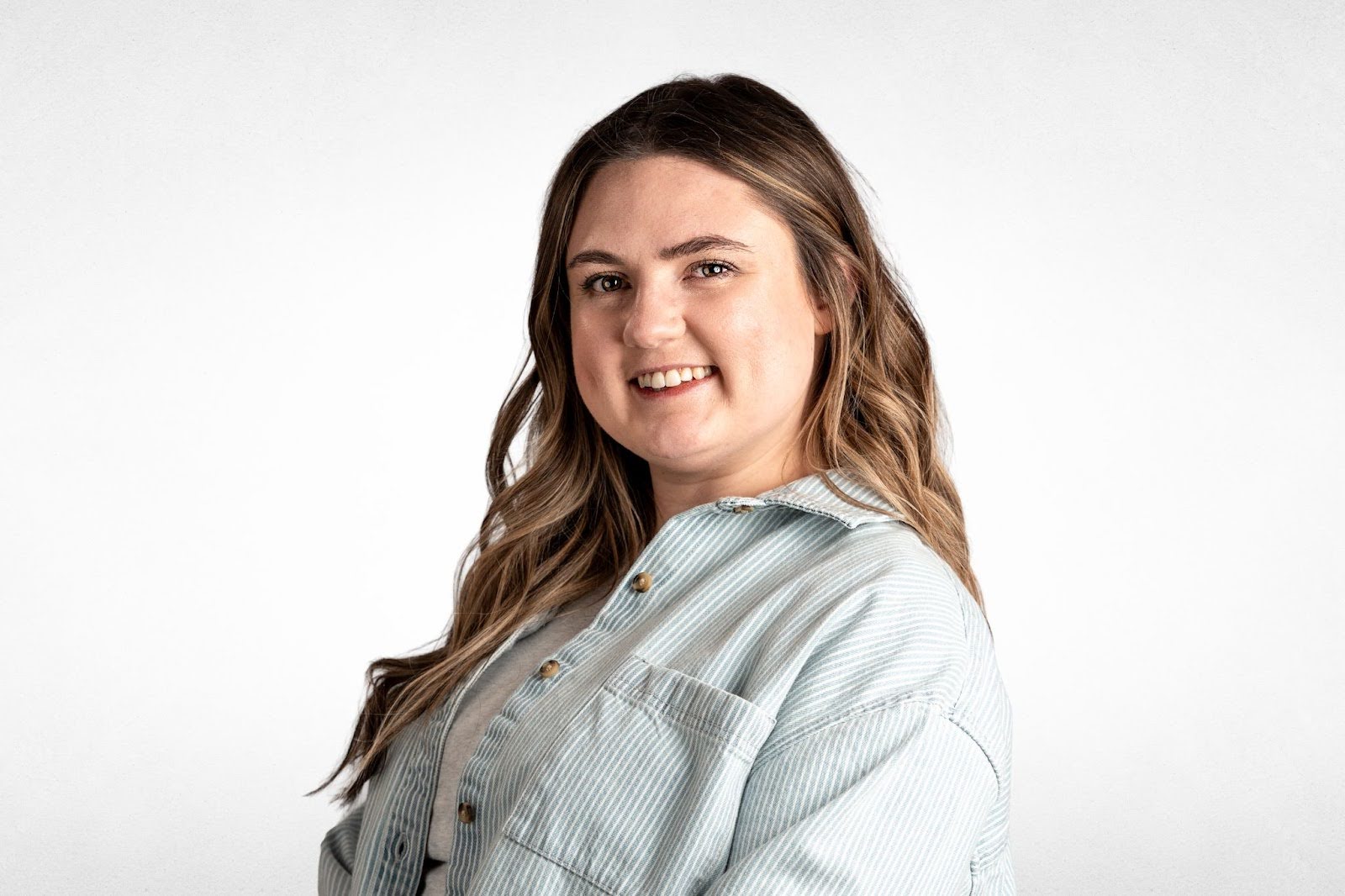 Woman smiling, promoting addiction recovery and mental health support services.