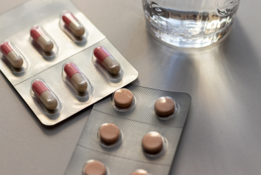 Prescription opioid medication pills in blister packs.