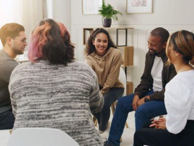 Empathetic group therapy session for addiction recovery and mental health support.